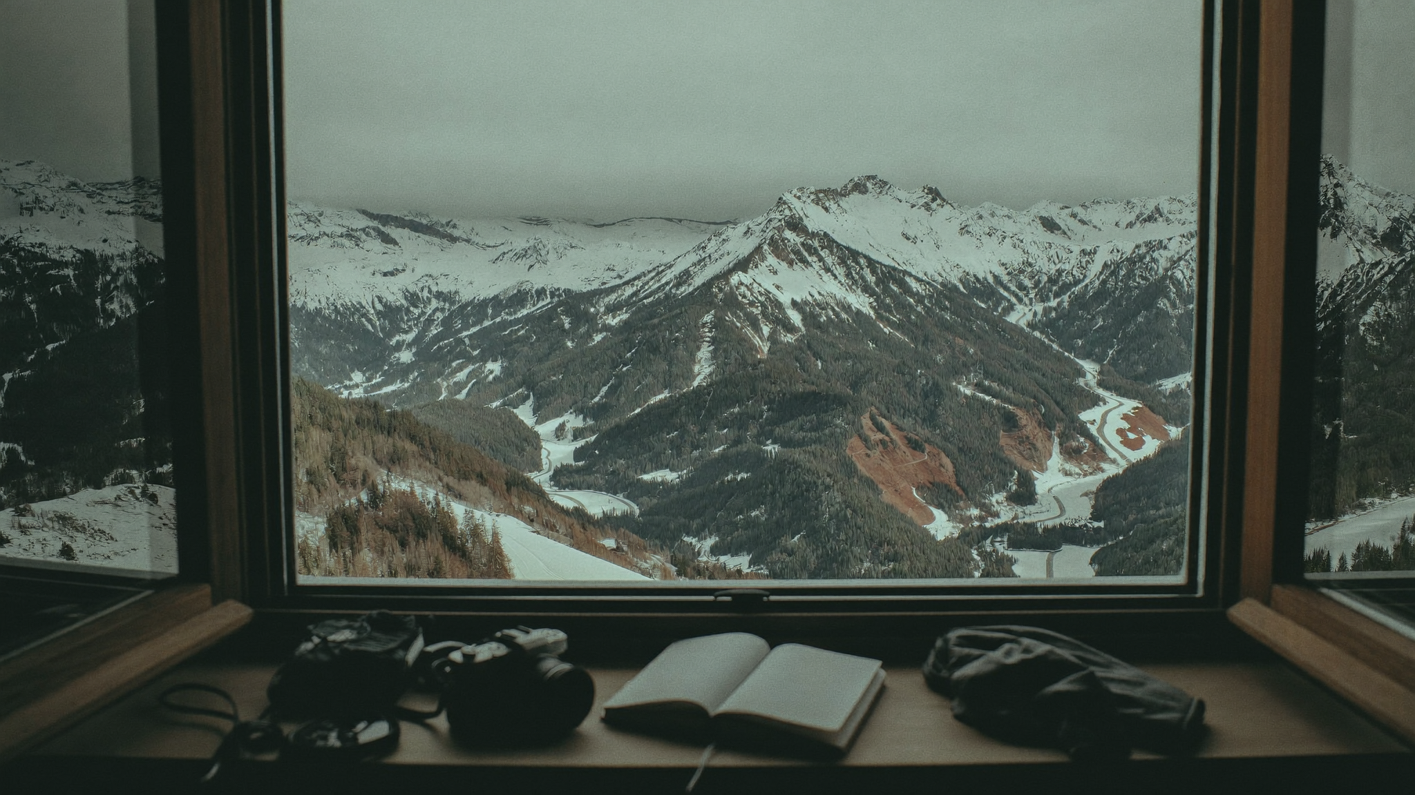 Snow-covered peaks and villages across an Andorran valley