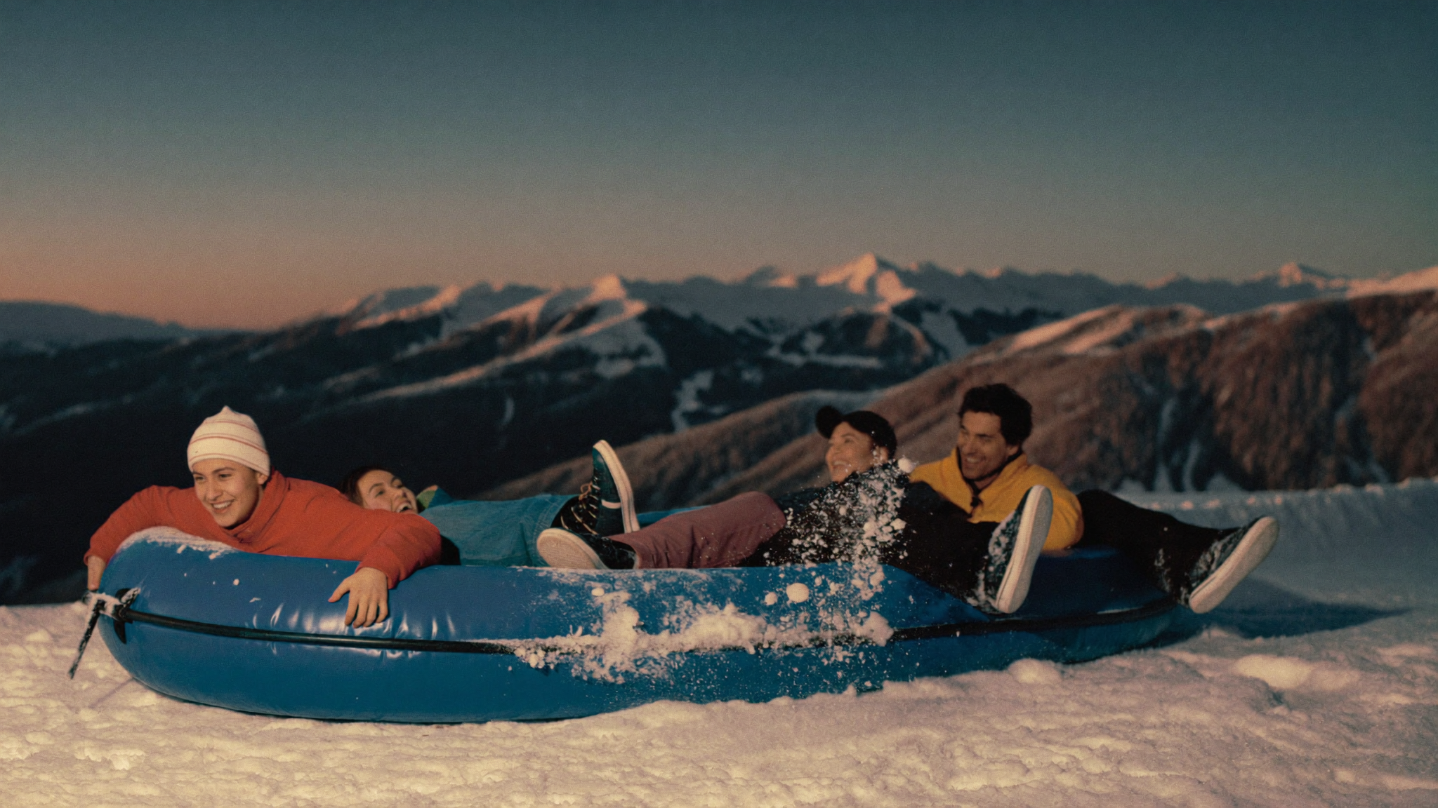 Colleagues gathered on the snow during a team event in Andorra