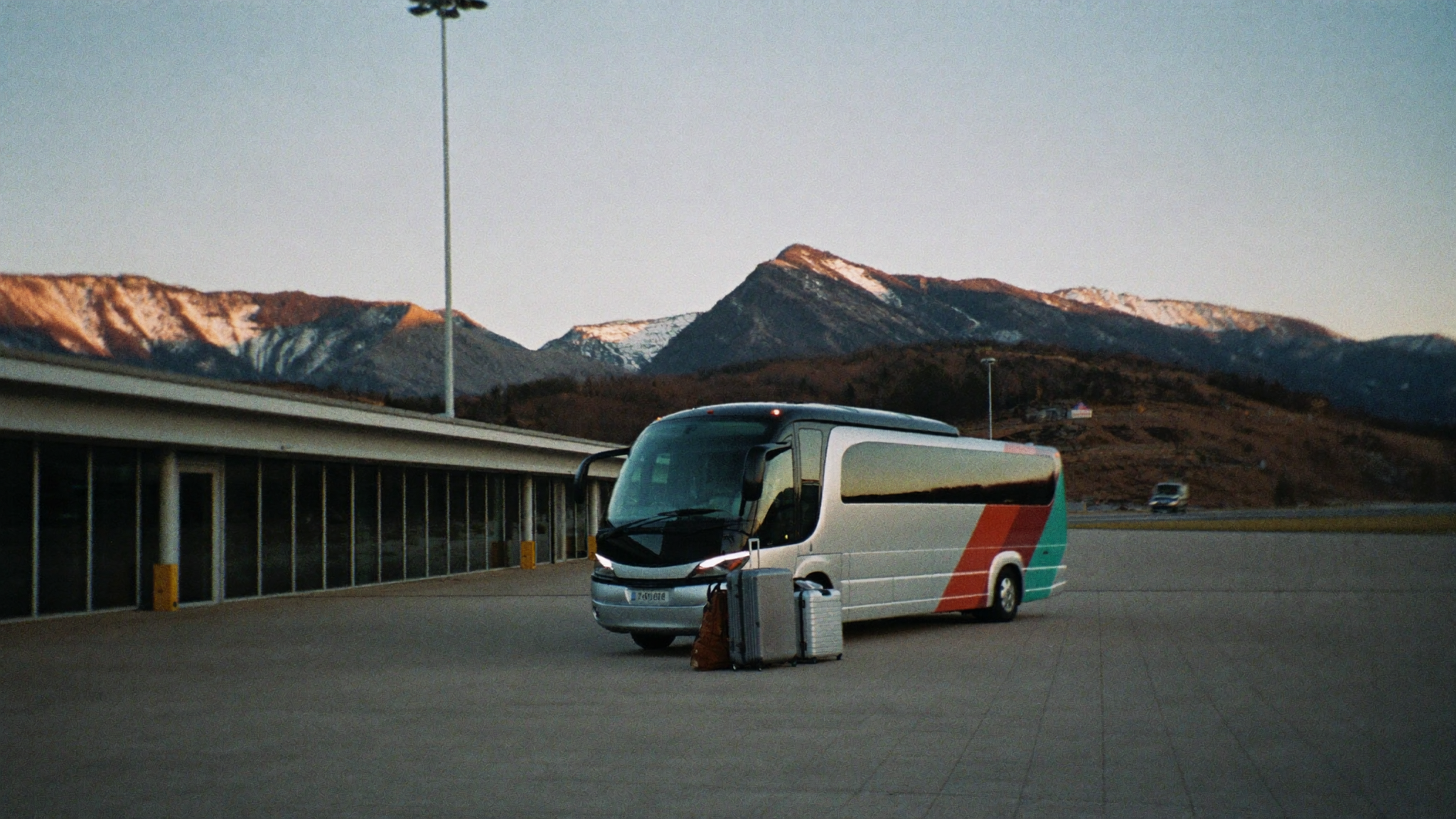 Airport departures hall and mountain highway toward Andorra