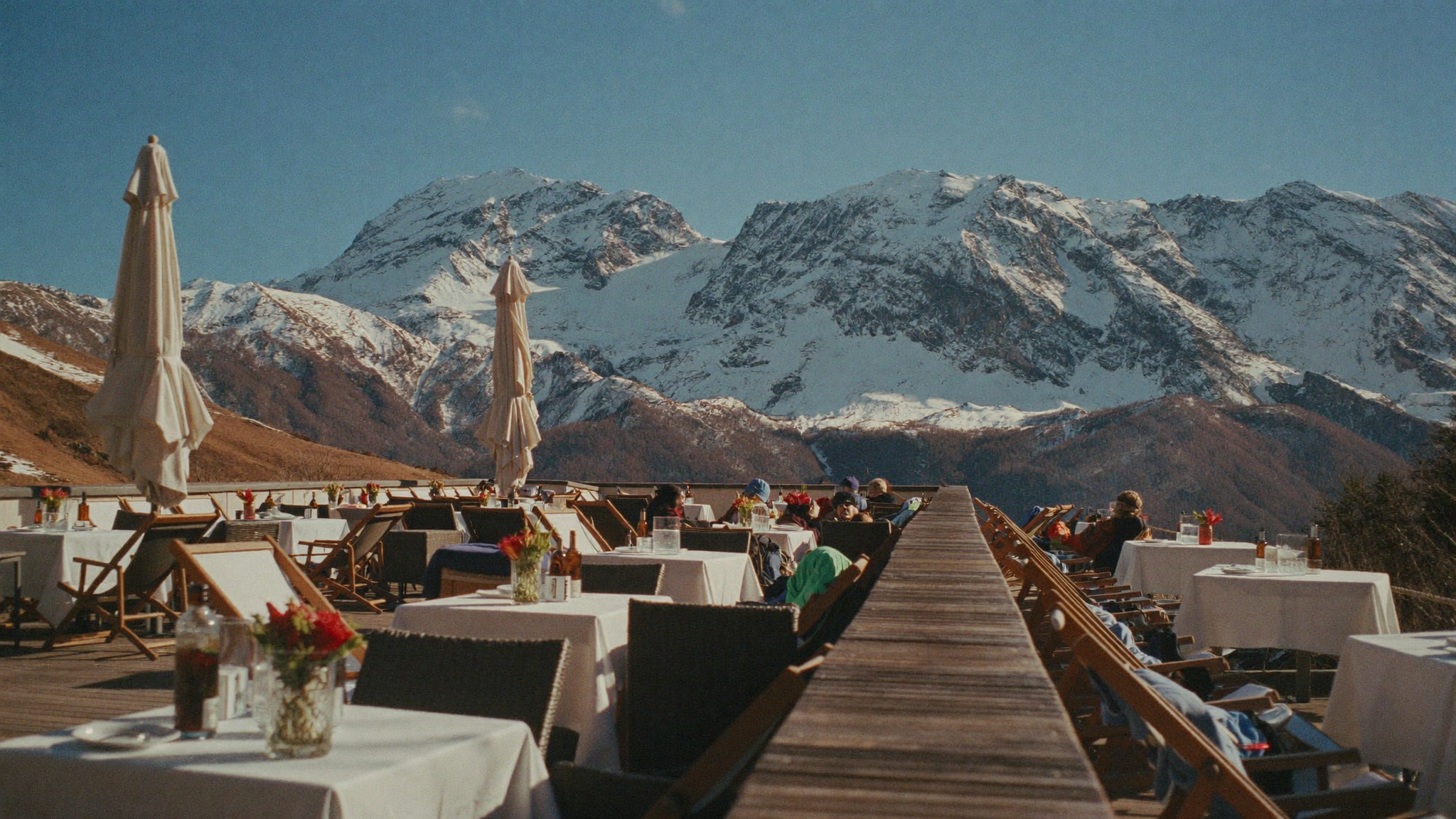 Snow-covered peaks above an Andorran valley village